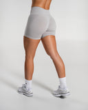 Amplify Mid Rise Short in LT Heather – women's mid-rise seamless compression shorts